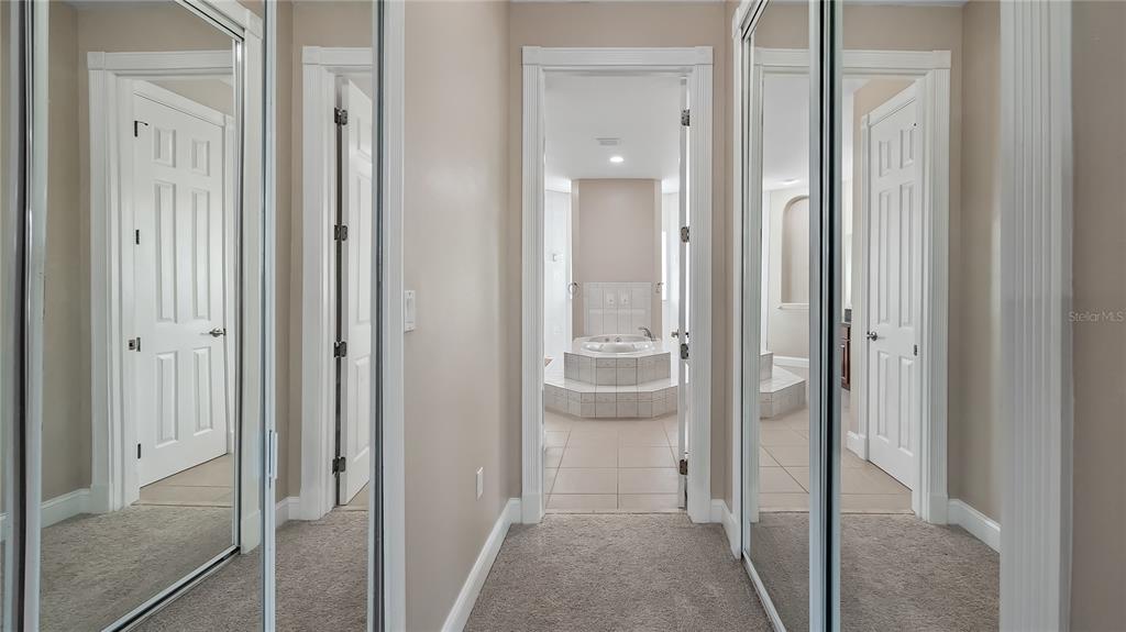 10651 Arrowtree Boulevard Clermont, FL 34715 - Photo 29 of 51 a view of a bathroom with a glass door shower