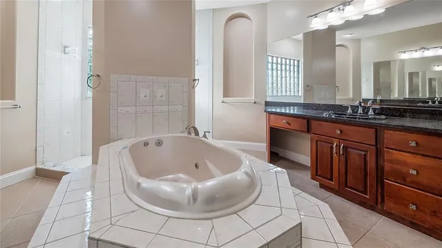 a bathroom with a bathtub and a shower