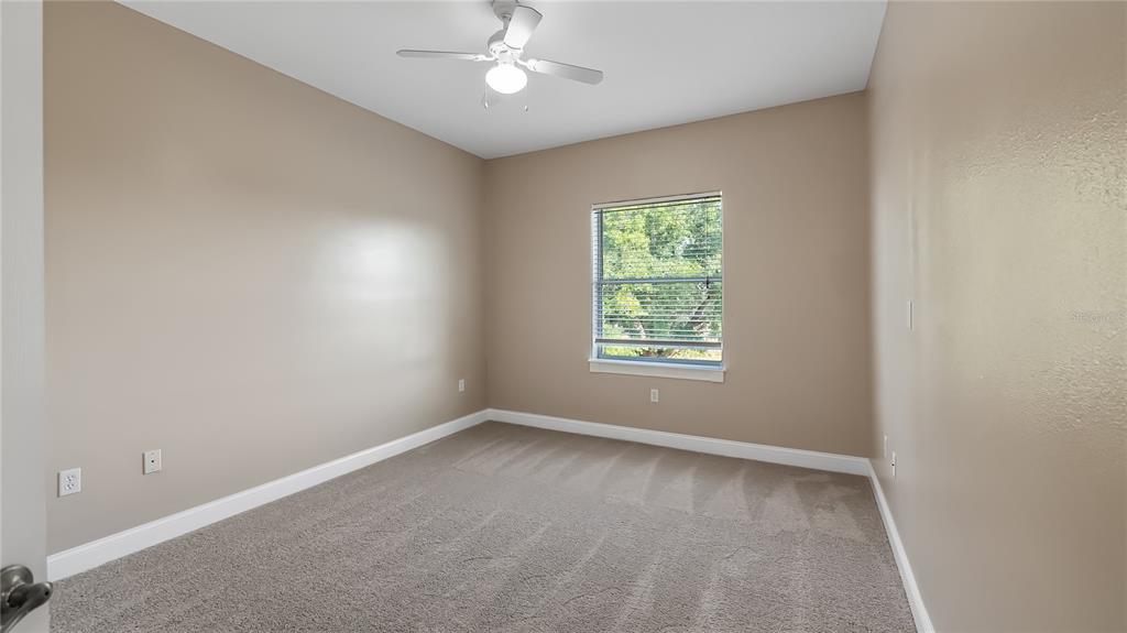 10651 Arrowtree Boulevard Clermont, FL 34715 - Photo 36 of 51 an empty room with a window