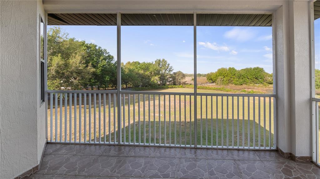 10651 Arrowtree Boulevard Clermont, FL 34715 - Photo 44 of 51 a view of a balcony with a green space