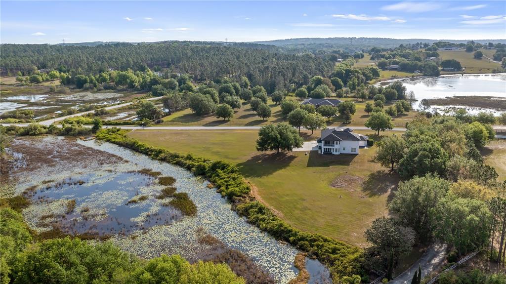 10651 Arrowtree Boulevard Clermont, FL 34715 - Photo 49 of 51 a view of a town with mountains ocean and mountain view