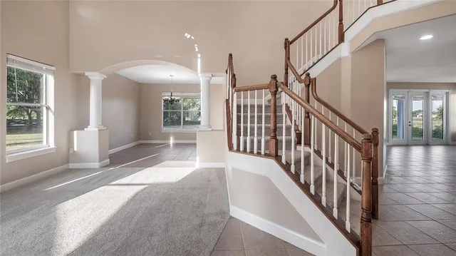 an empty room with windows and closet