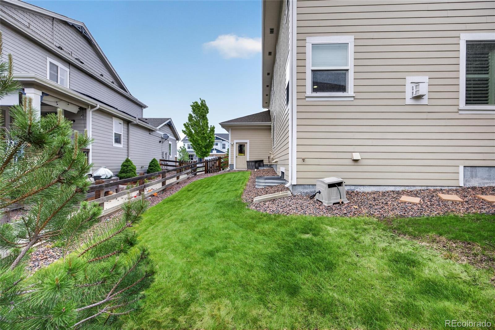 20554 East Shady Ridge Road Parker, CO 80134 - Photo 45 of 49 a backyard of a house with table and chairs