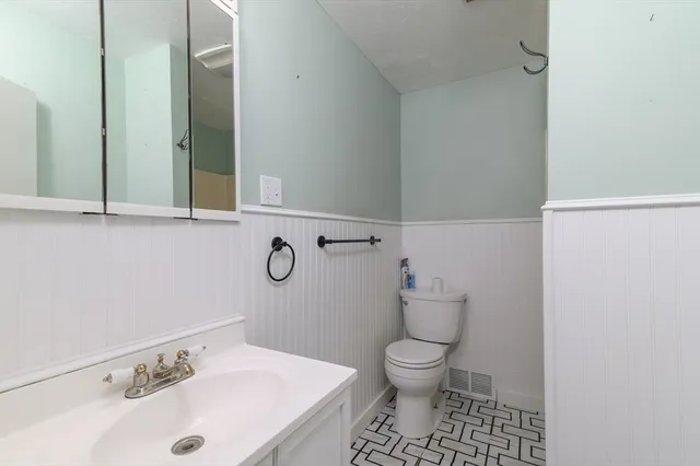 a bathroom with a sink and a toilet