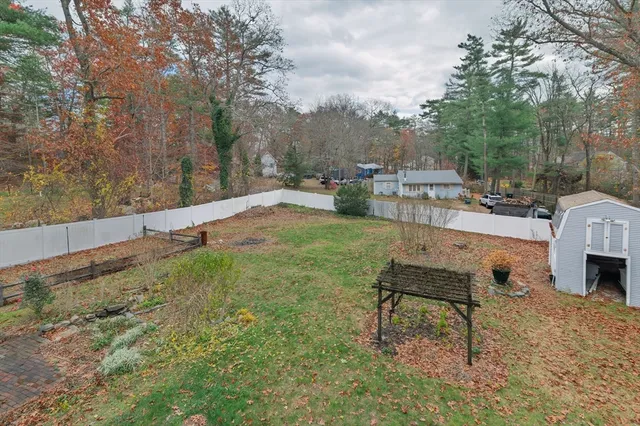 a view of backyard with swimming pool