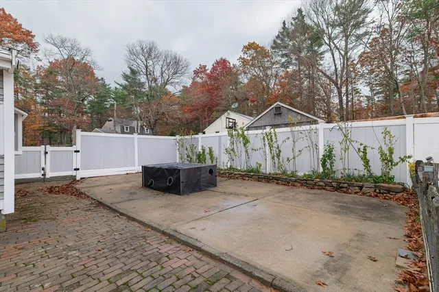 a view of a house with a yard and garage