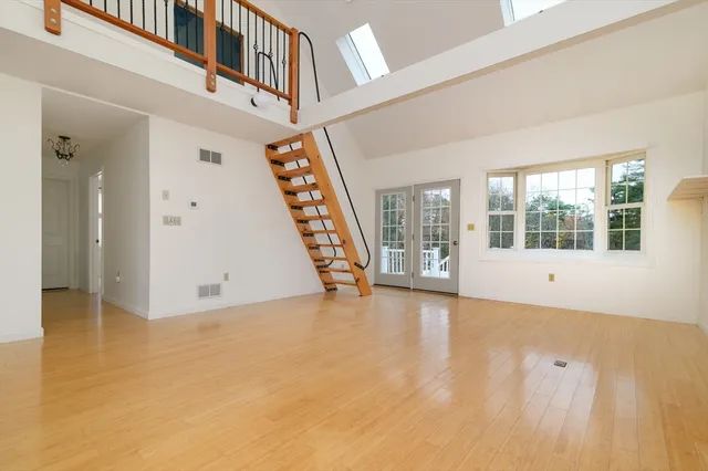 a view of an entryway with wooden floor