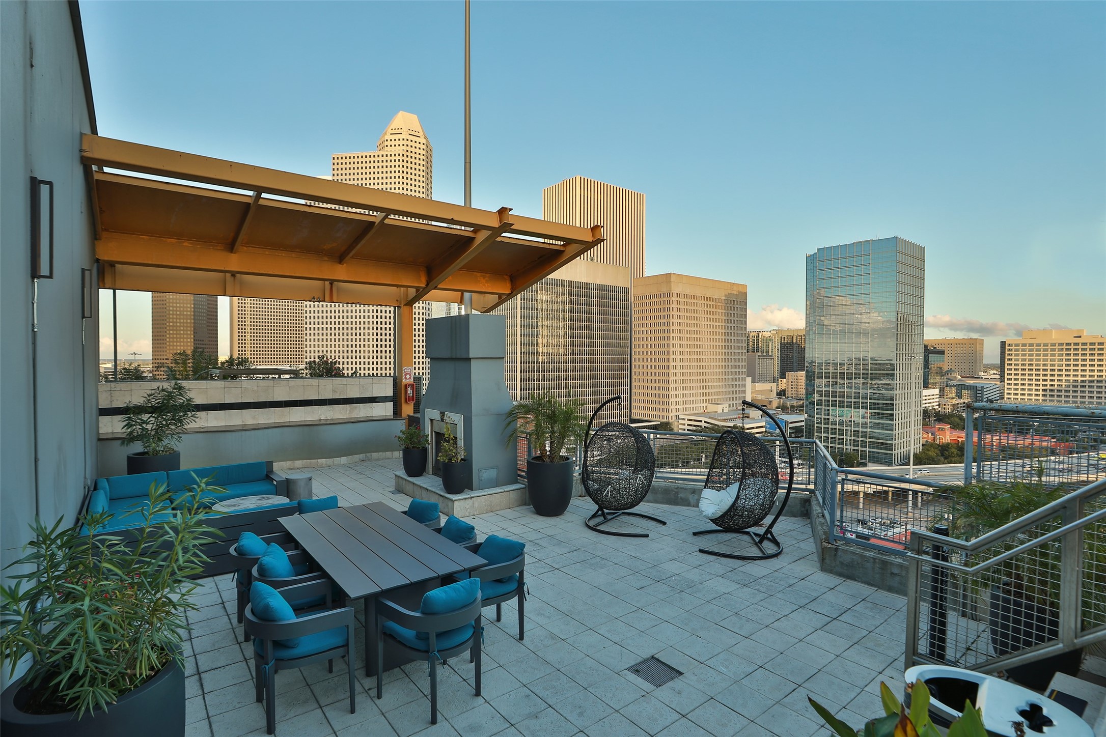 2000 Bagby Street, Unit 11415 Houston, TX 77002 - Photo 20 of 35 Roof top deck has an outdoor kitchen, fireplace, and lounging area to entertain your guests or relax and take in the views.