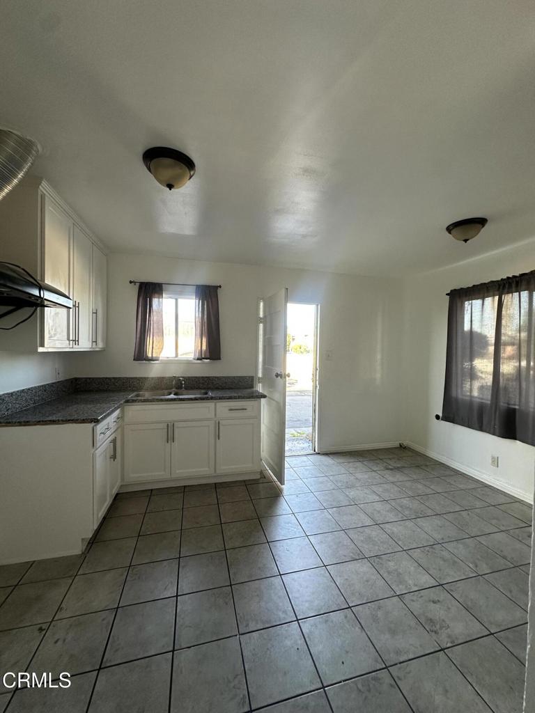 17002 Downey Avenue, Unit 17000 Paramount, CA 90723 - Photo 11 of 16 a large white kitchen with a large window