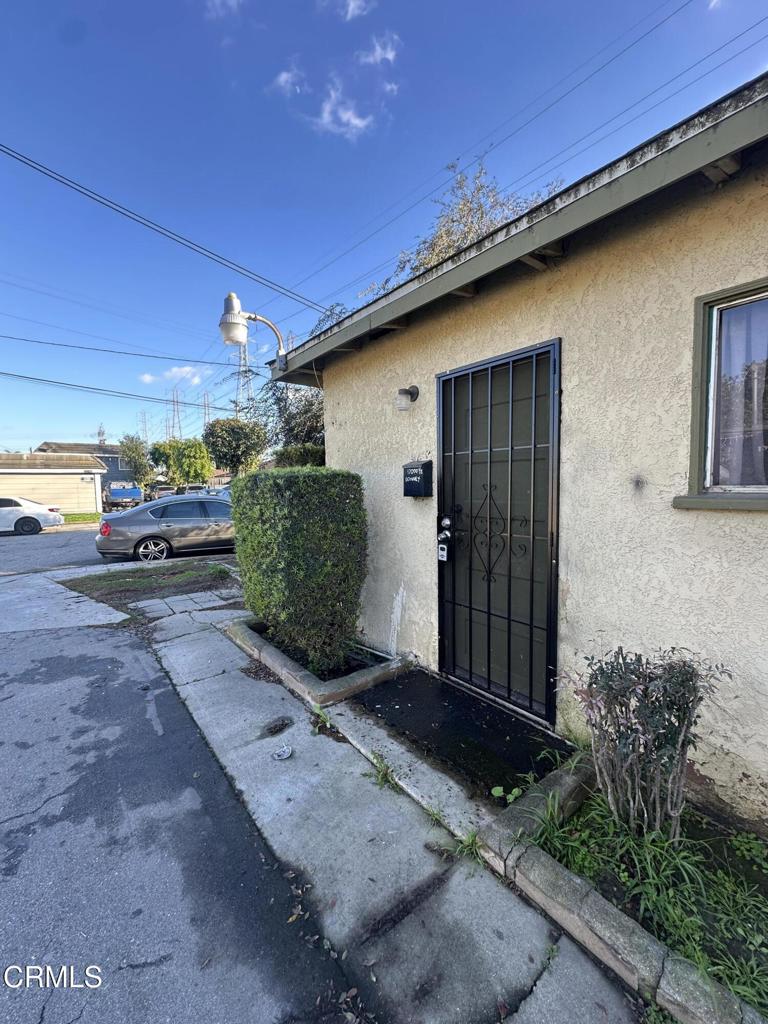 17002 Downey Avenue, Unit 17000 Paramount, CA 90723 - Photo 12 of 16 a house view with a backyard space