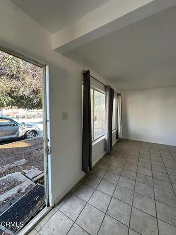 a view of an empty room and window