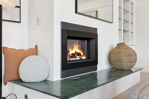 a kitchen with a dining table and chairs