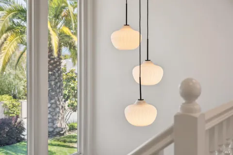 a kitchen with granite countertop a sink and cabinets