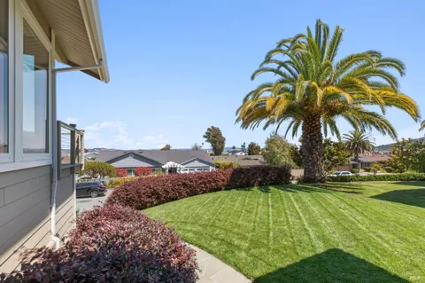 a view of entryway with livingroom and wooden floor