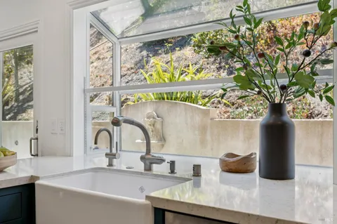 a living room with furniture or couch and a bookshelf