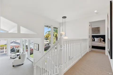a bathroom with a granite countertop sink a mirror and a bathtub