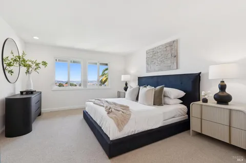 a view of a balcony with chair and potted plants