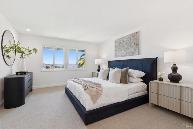 a view of a balcony with chair and potted plants