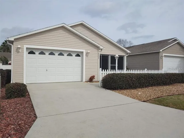 a front view of a house with garage