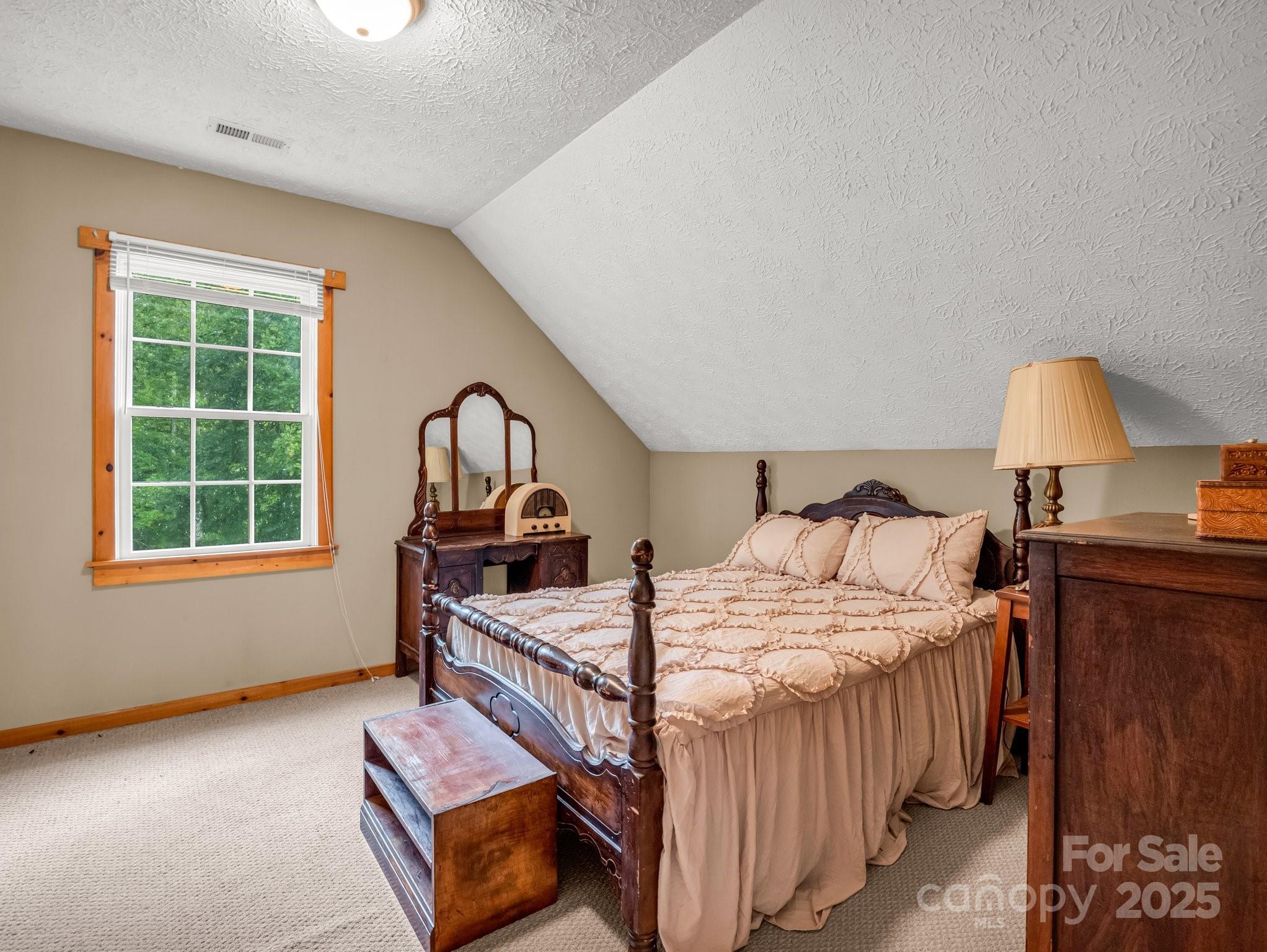 4086 Big Island Road Rutherfordton, NC 28139 - Photo 24 of 47 a bedroom with a bed next to a window