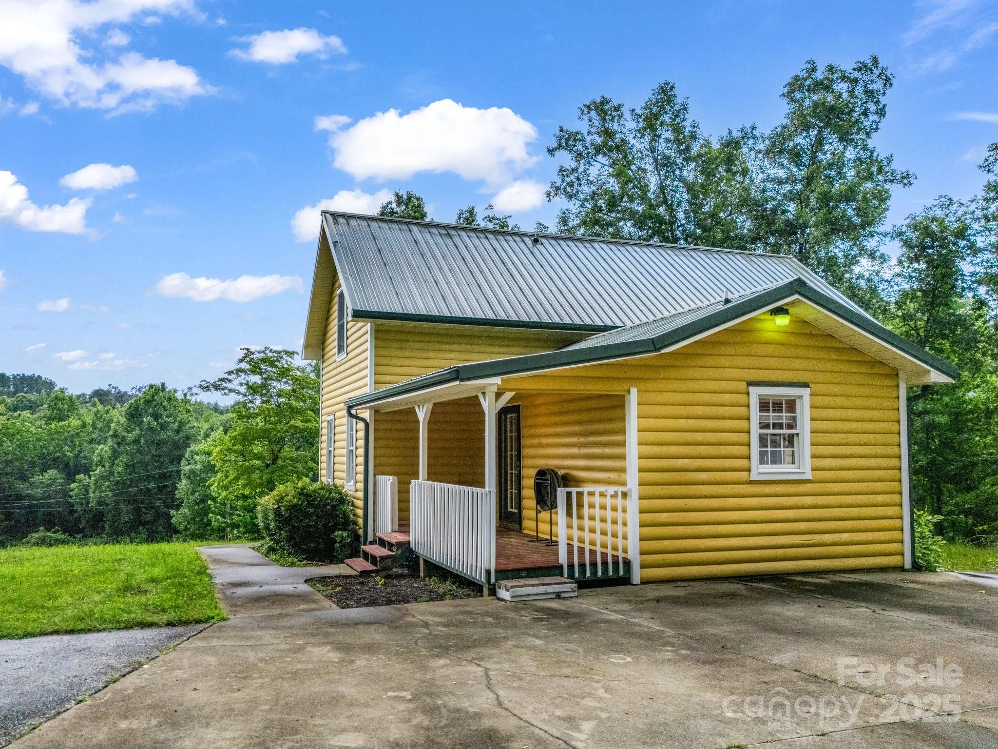 4086 Big Island Road Rutherfordton, NC 28139 - Photo 38 of 47 a view of a house with a yard and garage