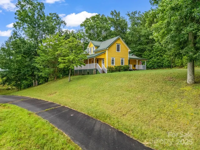 a view of a city with lush green forest