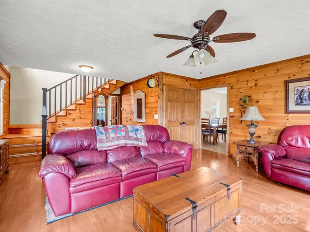 a living room with furniture fireplace and flat screen tv