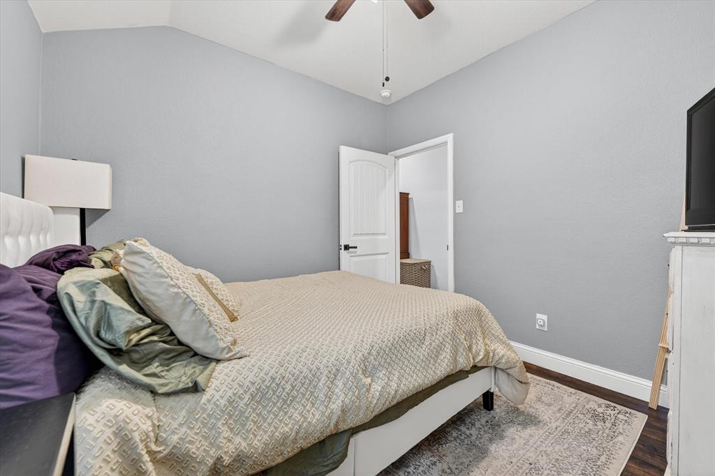833 Rutherford Drive Crowley, TX 76036 - Photo 13 of 30 Guess Bedroom with Fan and Hardwood Floors