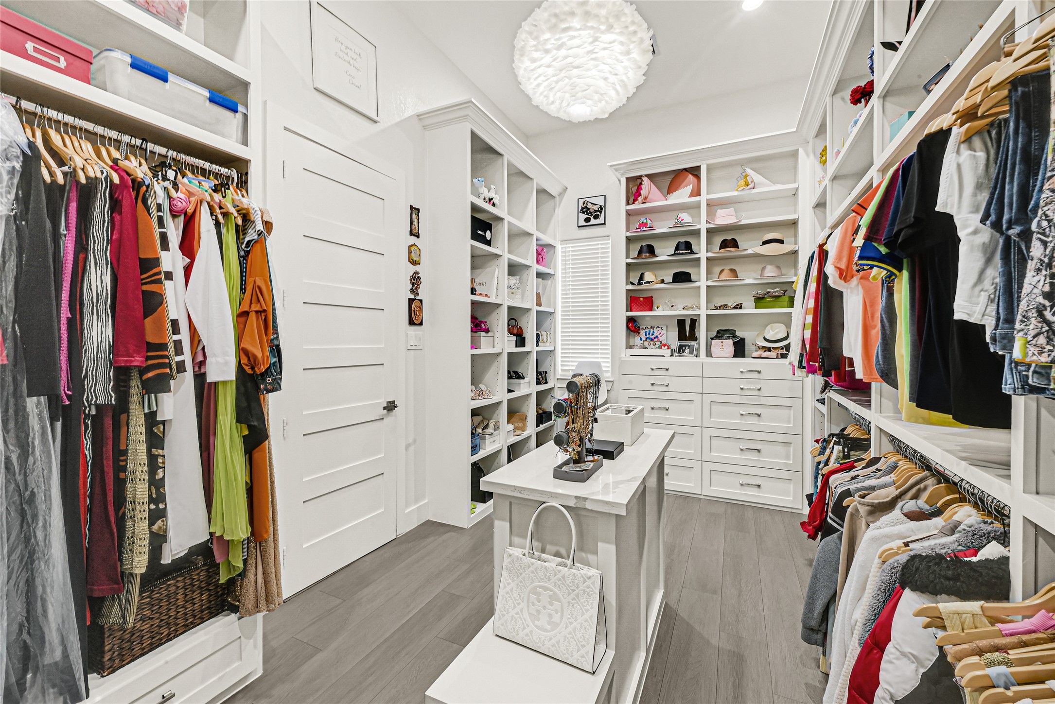 4821 1st Street Houston, TX 77504 - Photo 17 of 48 a view of walk in closet with clothes and shoes