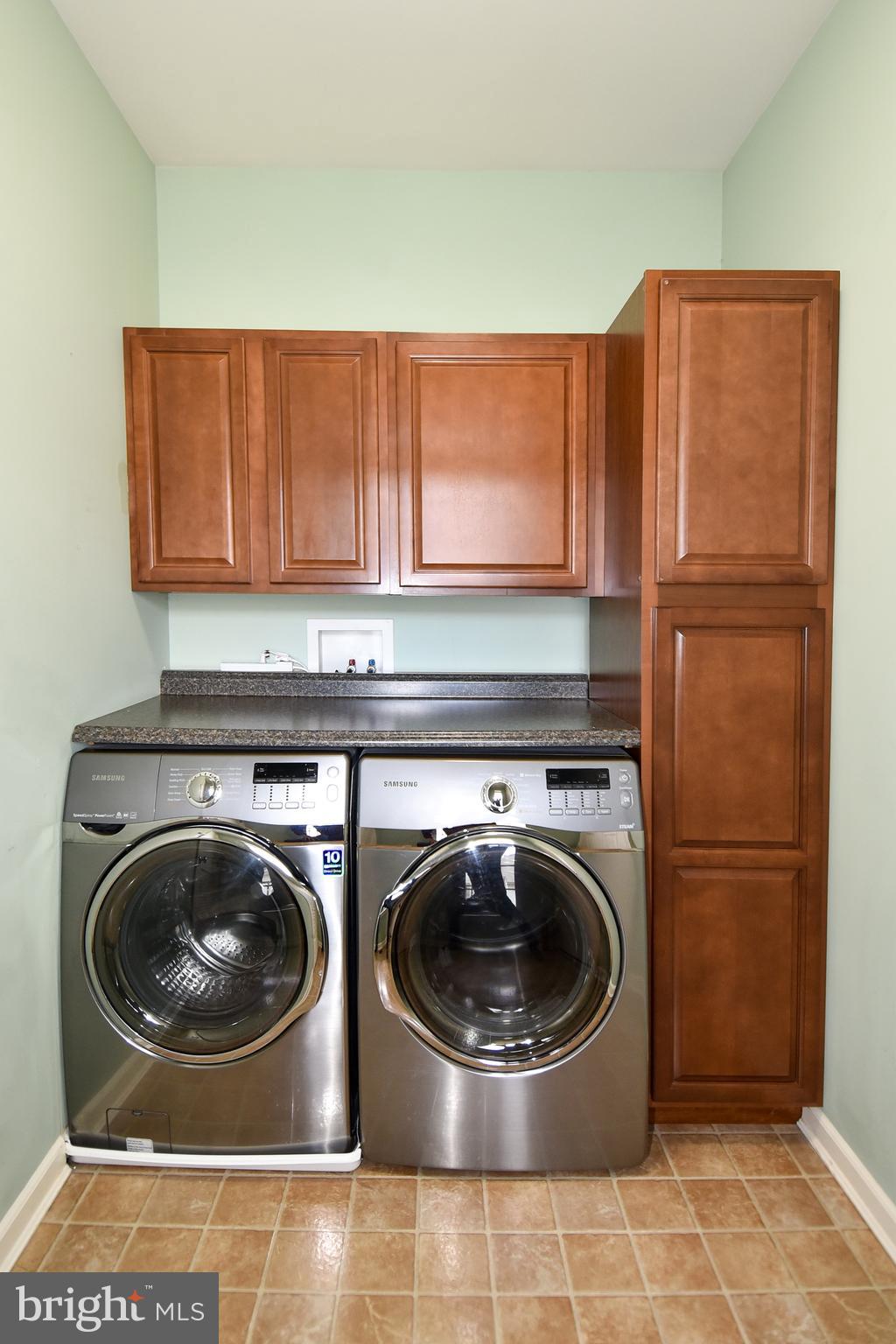 7836 Callington Way Hanover, MD 21076 - Photo 14 of 48 FRONT LOADER WASHER AND DRYER AND EXTRA CABINETS