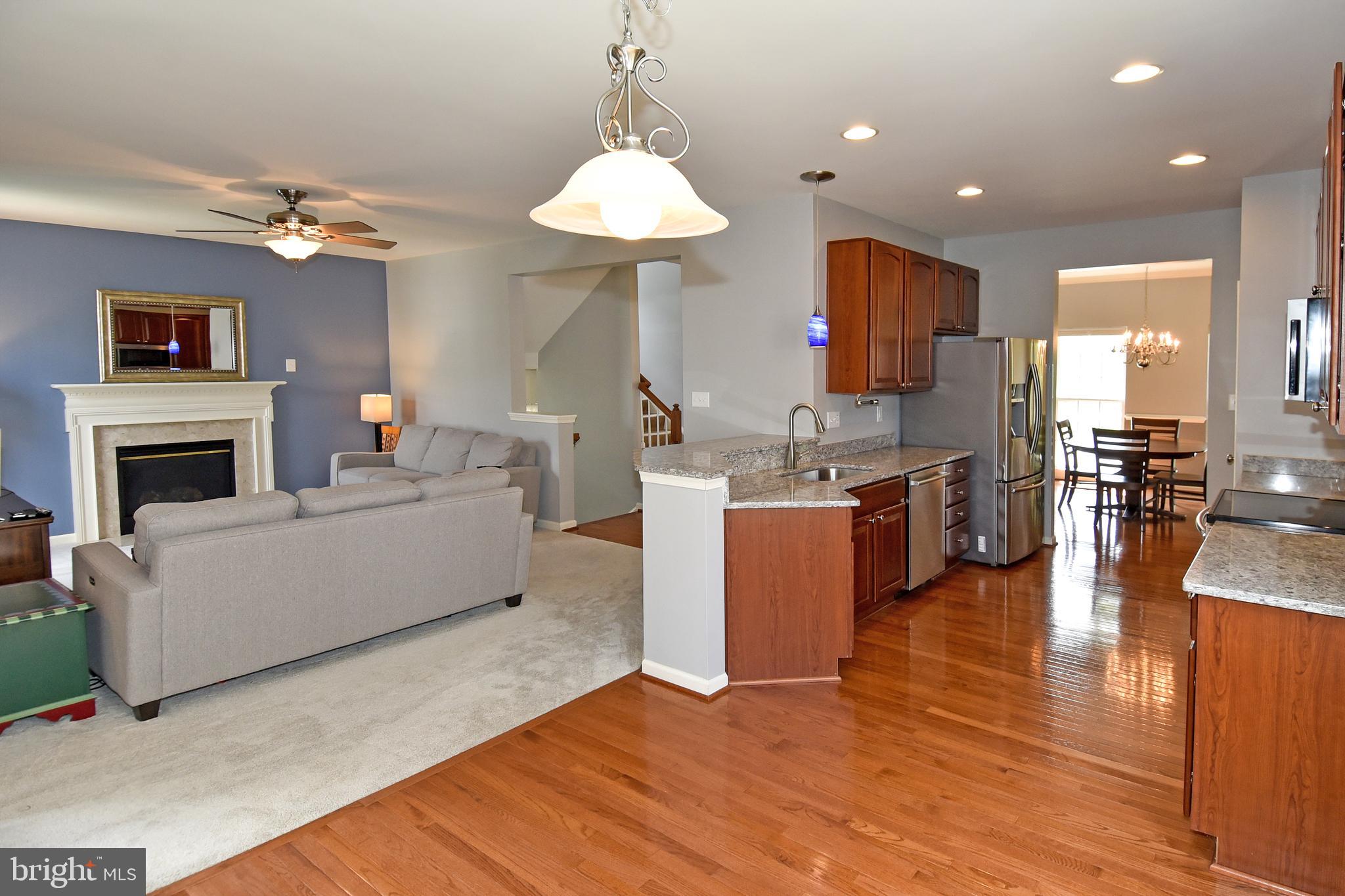 7836 Callington Way Hanover, MD 21076 - Photo 16 of 48 VIEW OF LIVING ROOM AND KITCHEN FROM BREAKFAST RM