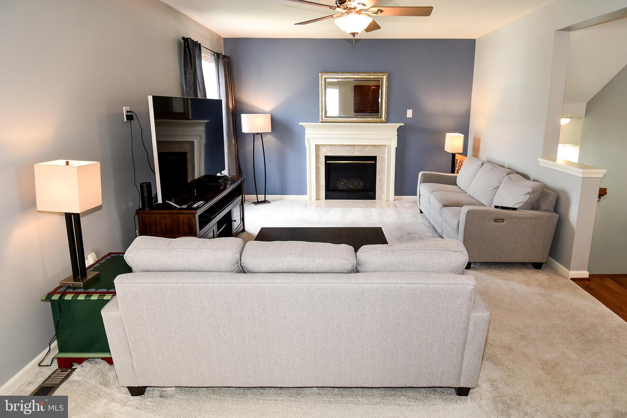 7836 Callington Way Hanover, MD 21076 - Photo 18 of 48 LIVING ROOM HAS GAS FIREPLACE & MANTEL