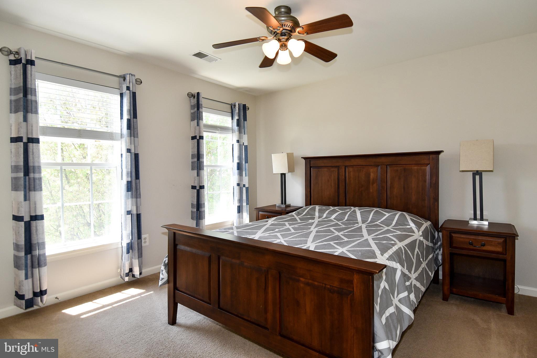 7836 Callington Way Hanover, MD 21076 - Photo 33 of 48 UPPER LEVEL BEDROOM 2 HAS LIGHTED CEILING FAN
