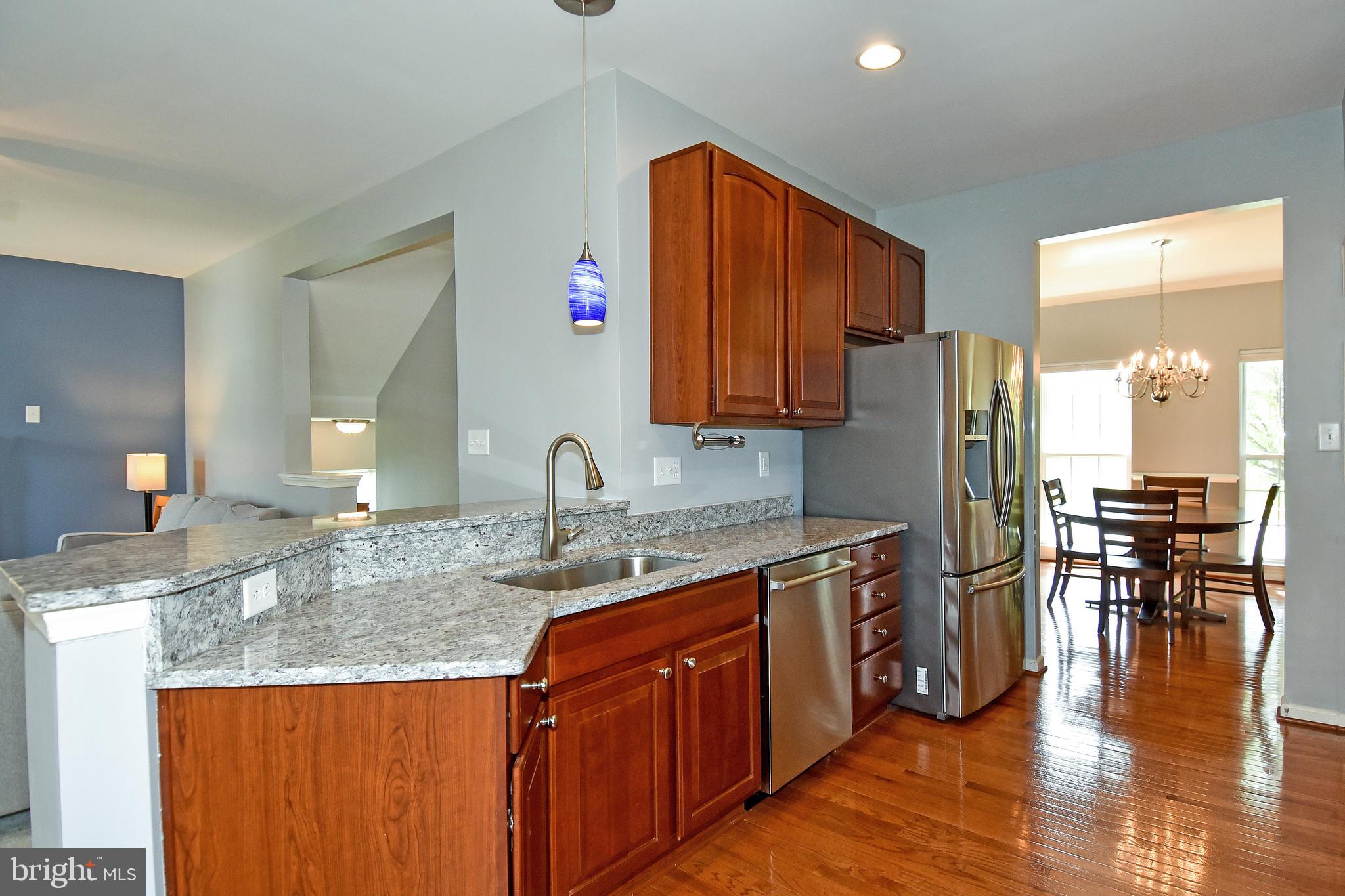 7836 Callington Way Hanover, MD 21076 - Photo 10 of 48 KITCHEN HAS GRANITE COUNTERTOPS & BREAKFAST BAR