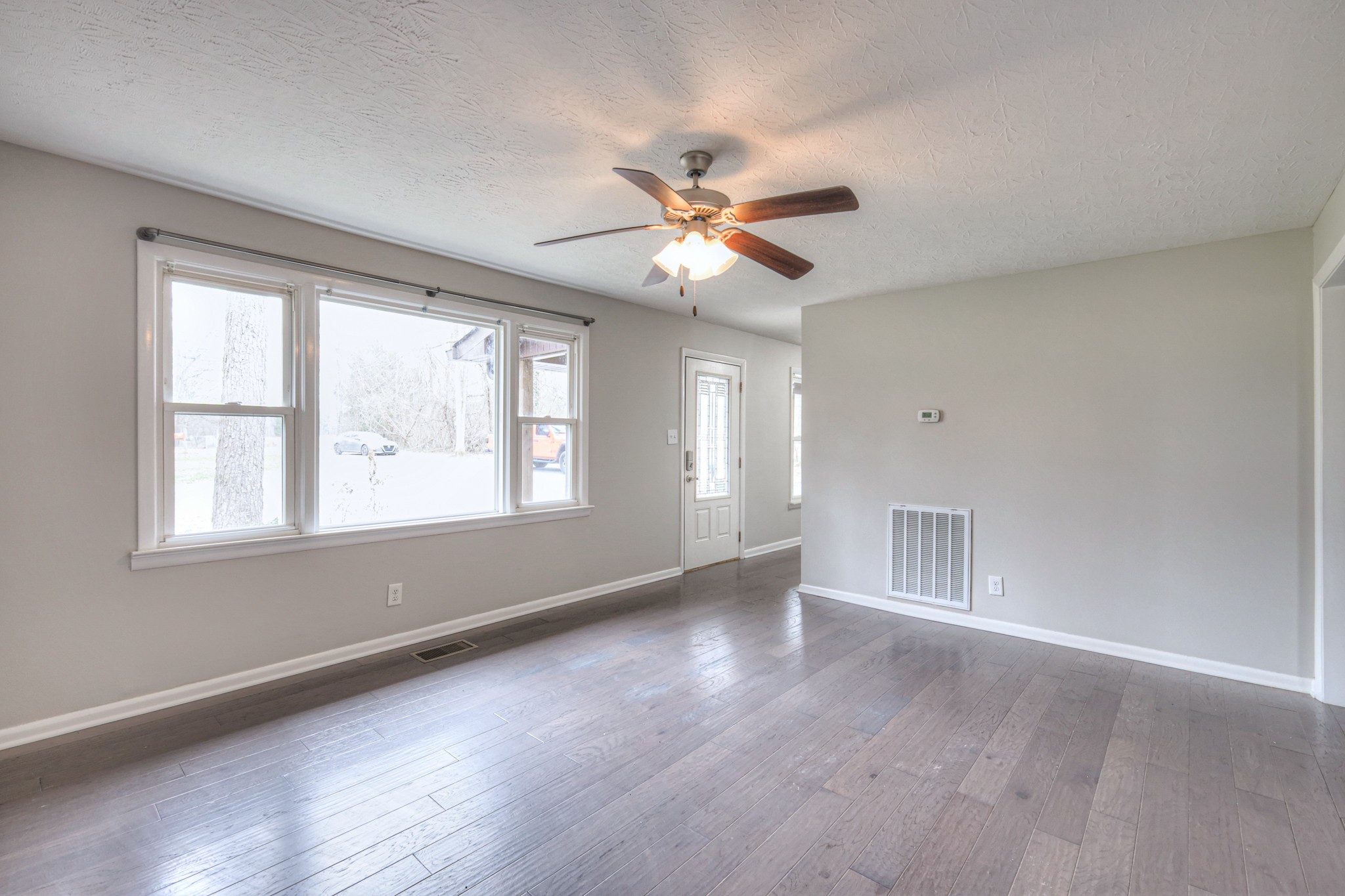 320 Ramsey Road Lebanon, TN 37087 - Photo 13 of 28 wooden floor in an empty room with a window