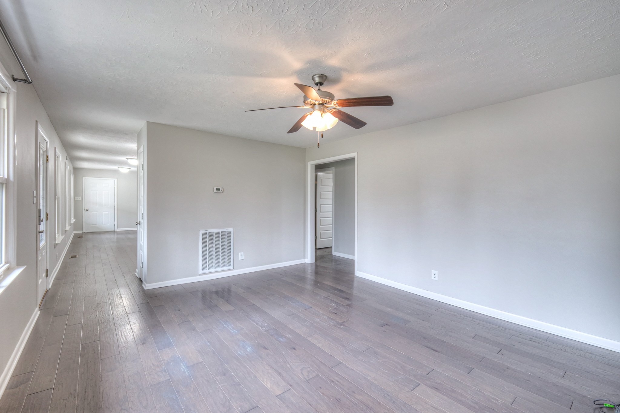 320 Ramsey Road Lebanon, TN 37087 - Photo 14 of 28 a view of a room with wooden floor and a ceiling fan