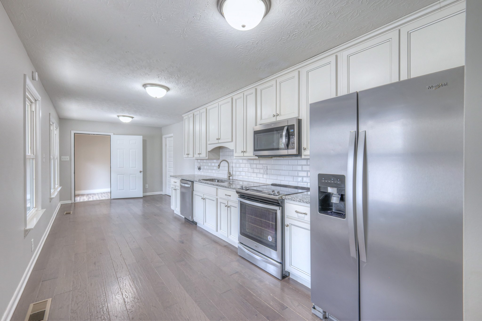 320 Ramsey Road Lebanon, TN 37087 - Photo 7 of 28 a large kitchen with cabinets and stainless steel appliances