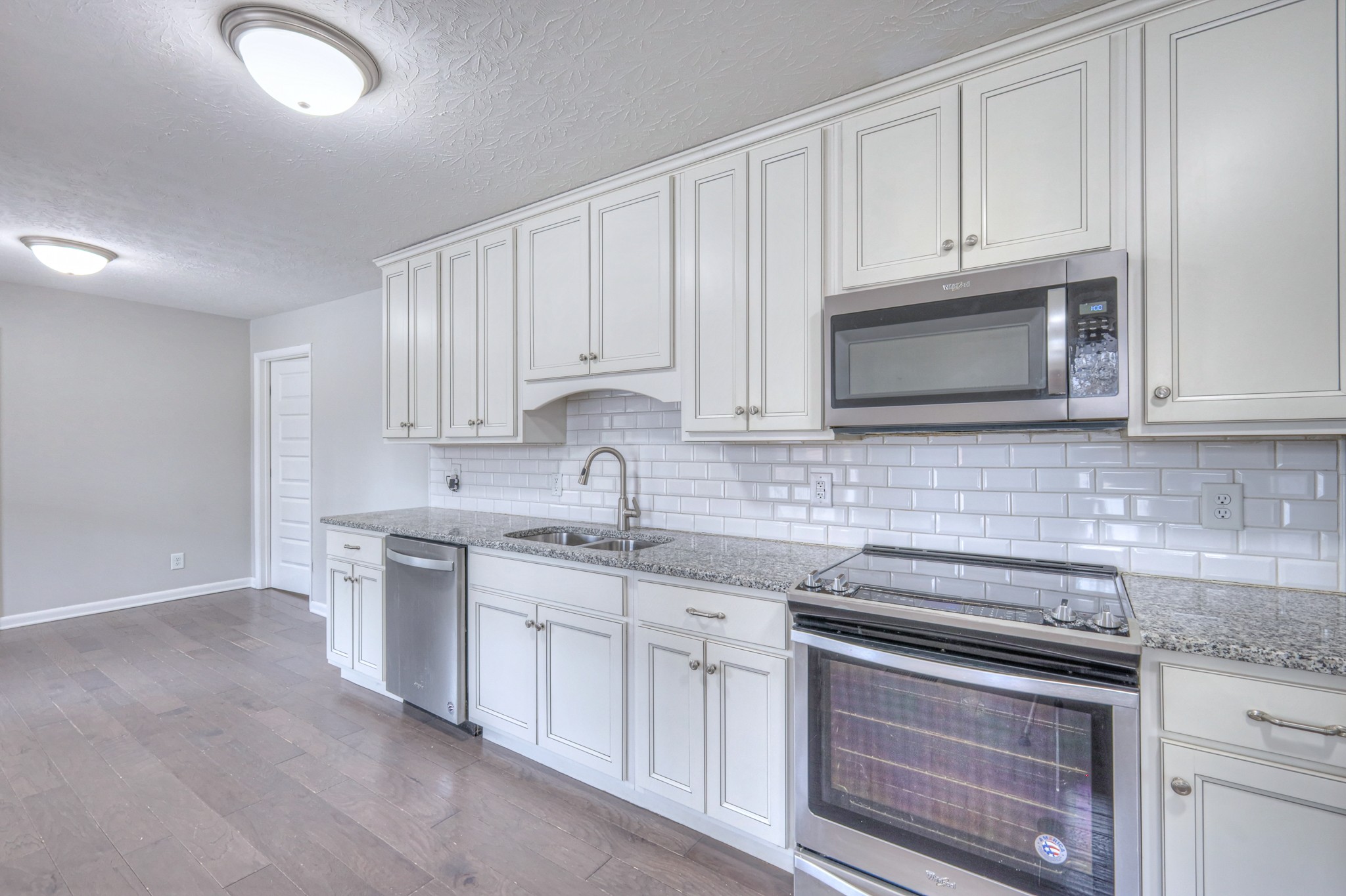 320 Ramsey Road Lebanon, TN 37087 - Photo 8 of 28 a kitchen with appliances a sink and cabinets