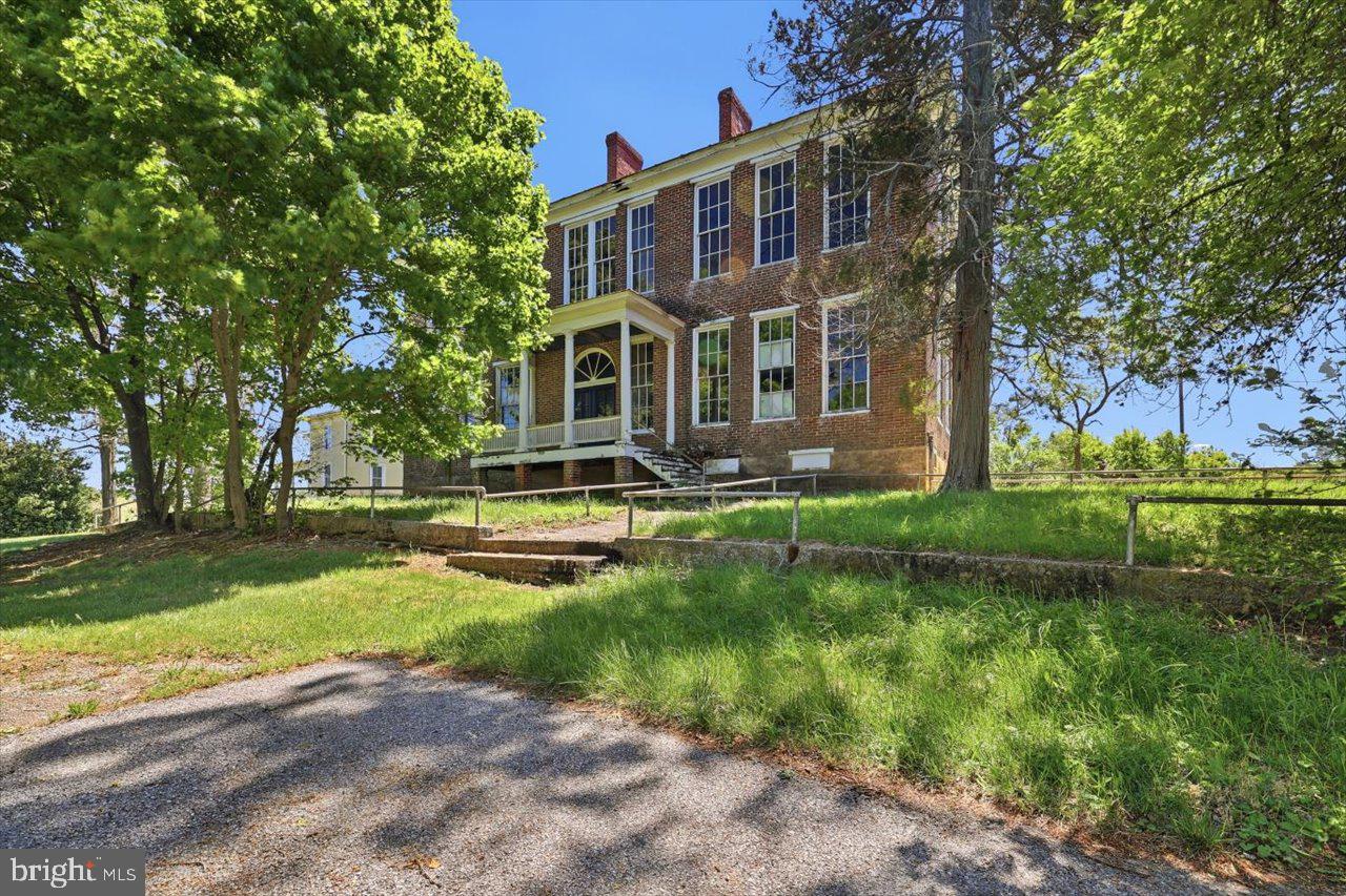 38 Cherry Grove Road Middlebrook, VA 24459 - Photo 30 of 31 a front view of a house with garden and trees