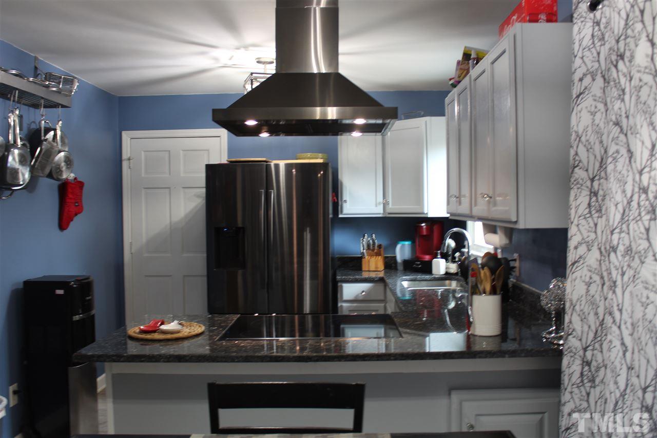 7010 Sorrell Lane Raleigh, NC 27603 - Photo 11 of 29 Kitchen Newly Remodeled, Granite Countertops, New Stainless Appliances, Exteriorly Vented Stainless Hood