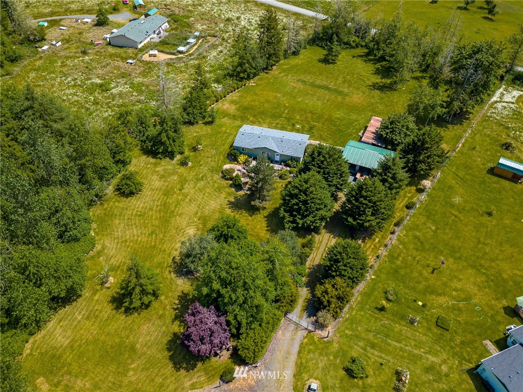144 Hershel Road Chehalis, WA 98532 - Photo 1 of 40 a view of a garden with plants