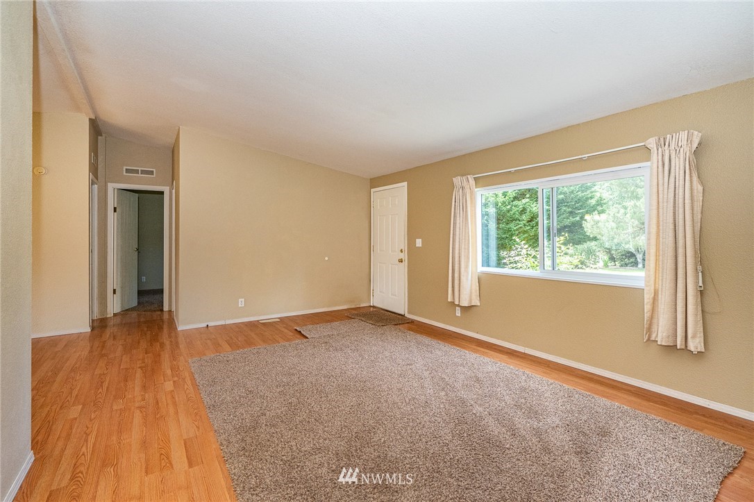 144 Hershel Road Chehalis, WA 98532 - Photo 4 of 40 a view of an empty room with a window