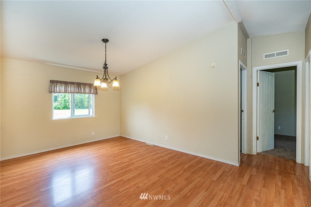 144 Hershel Road Chehalis, WA 98532 - Photo 8 of 40 a view of empty room with wooden floor and fan