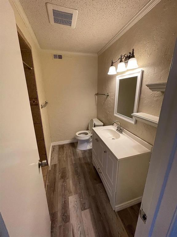 6315 Campbell Road, Unit 602 Dallas, TX 75248 - Photo 16 of 40 a bathroom with a sink mirror and toilet