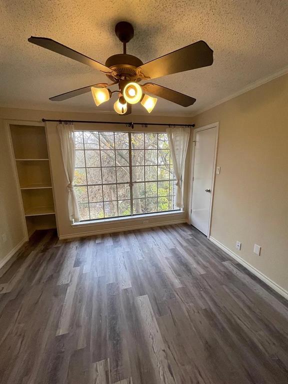 6315 Campbell Road, Unit 602 Dallas, TX 75248 - Photo 17 of 40 wooden floor in an empty room with a window