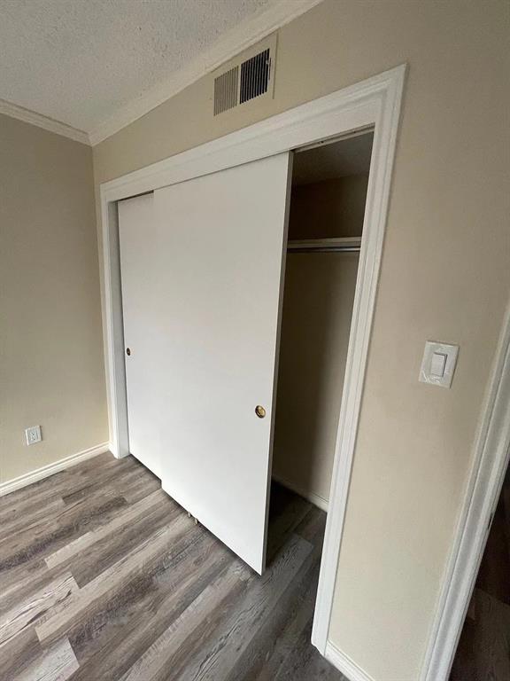 6315 Campbell Road, Unit 602 Dallas, TX 75248 - Photo 22 of 40 an entryway with wooden floor