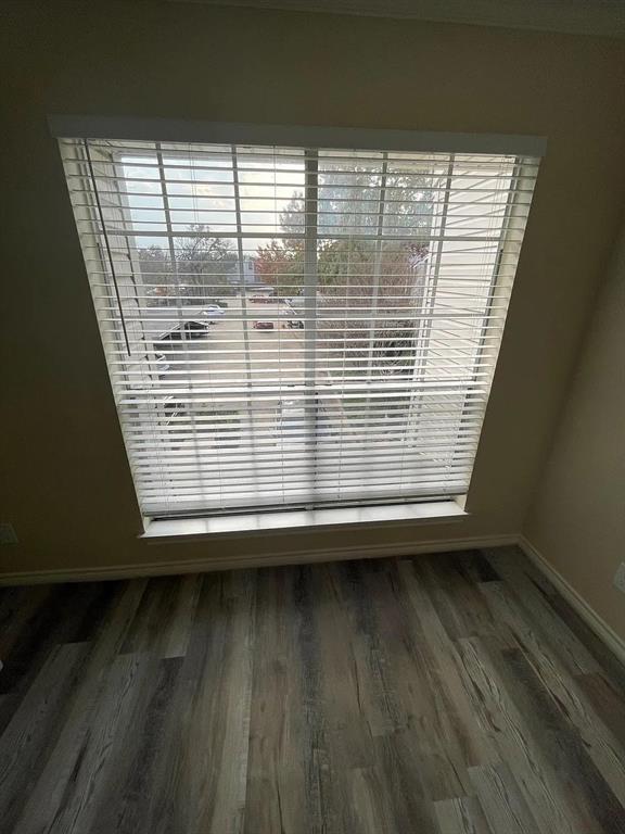 6315 Campbell Road, Unit 602 Dallas, TX 75248 - Photo 23 of 40 a view of a small space with wooden floor and a window
