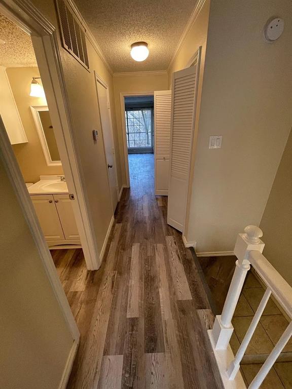 6315 Campbell Road, Unit 602 Dallas, TX 75248 - Photo 27 of 40 a view of hallway with wooden floor