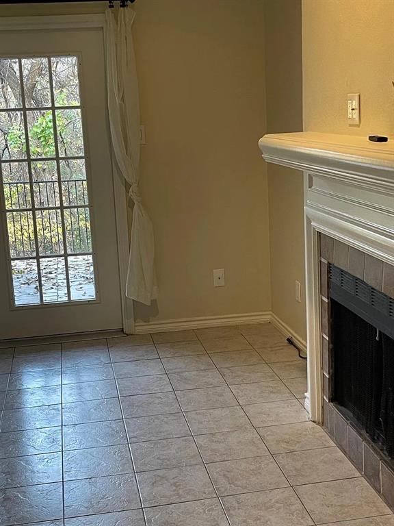 6315 Campbell Road, Unit 602 Dallas, TX 75248 - Photo 37 of 40 a view of an empty room with a fireplace and a window