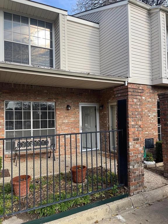 6315 Campbell Road, Unit 602 Dallas, TX 75248 - Photo 4 of 40 a front view of a building with a glass door